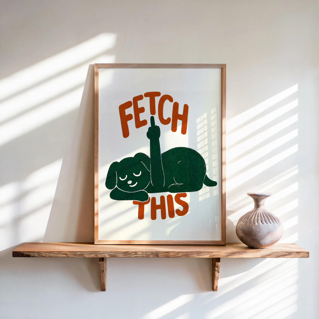 Shelf display with framed cream print, forest green dog silhouette and rust-orange FETCH THIS lettering, sarcastic dog art, funny dog wall art