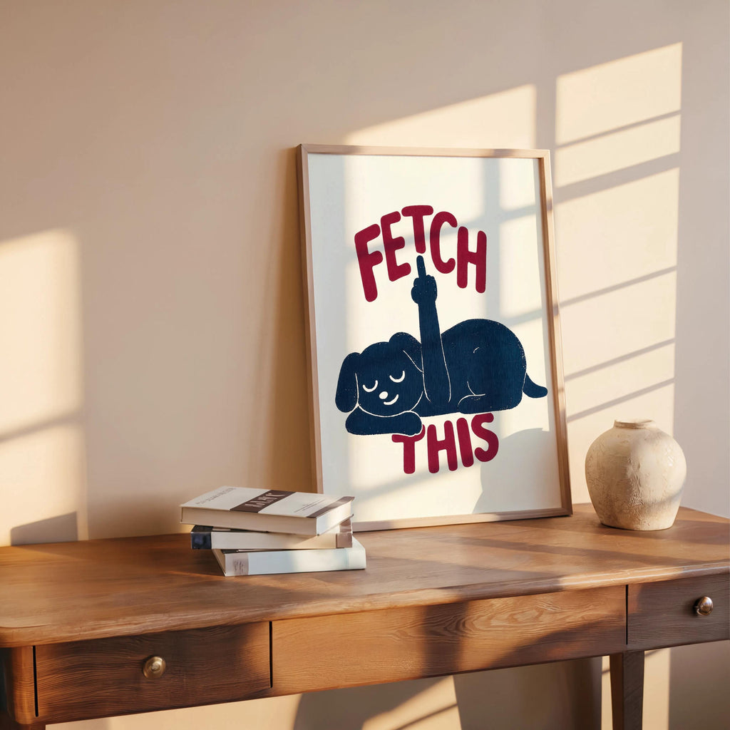 Wooden shelf vignette with leaning framed print, deep navy dog and bold rust text, retro dog artwork and funny dog wall art