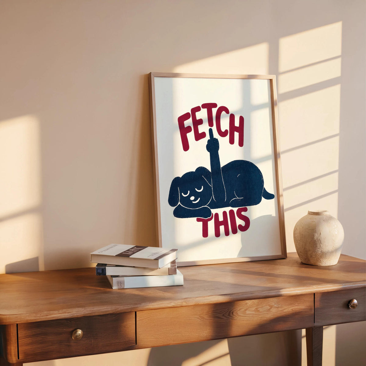 Wooden shelf vignette with leaning framed print, deep navy dog and bold rust text, retro dog artwork and funny dog wall art