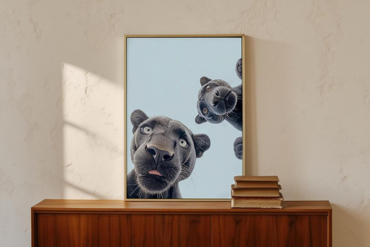 Small framed black panther nursery wall art centered on mid-century wood dresser, soft sunlight
