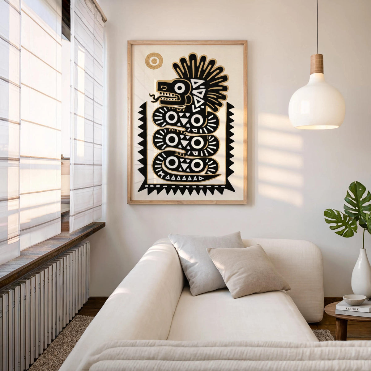 Quetzalcoatl wall art hung above a slouchy sofa with pendant light, relaxed latin american wall art in living room