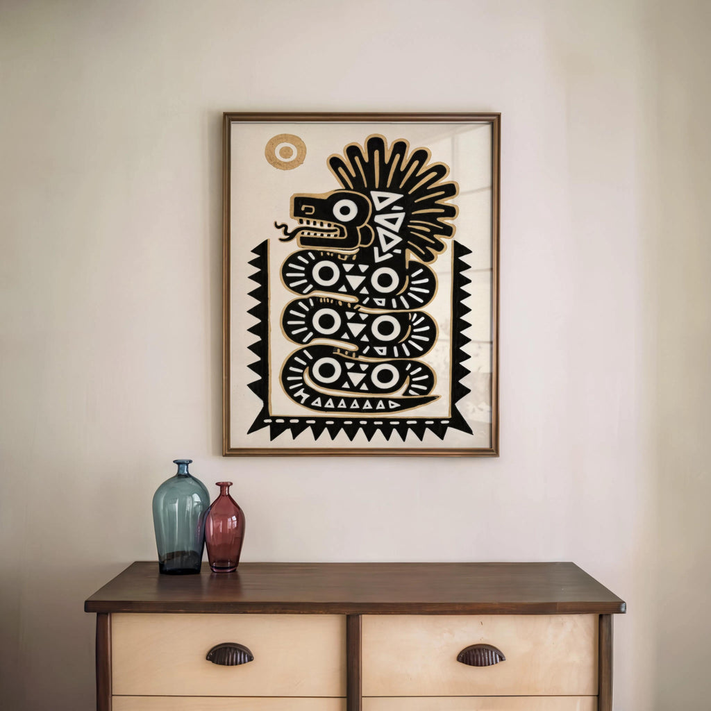 Black and gold art print framed over a wooden sideboard with decorative vases, modern mexico boho decor presentation