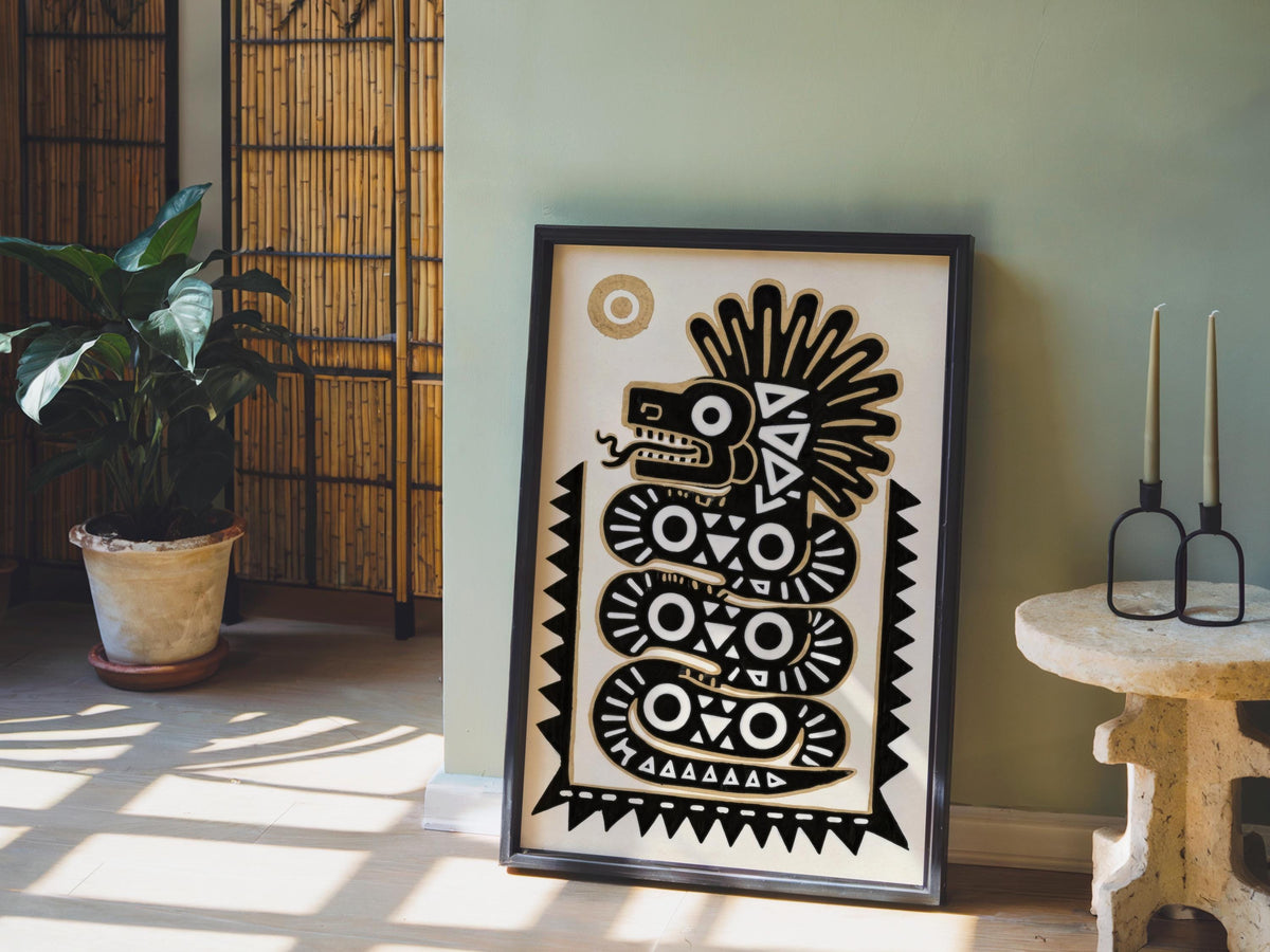 Framed quetzalcoatl wall art leaning by a potted plant and woven room screen, warm afternoon light