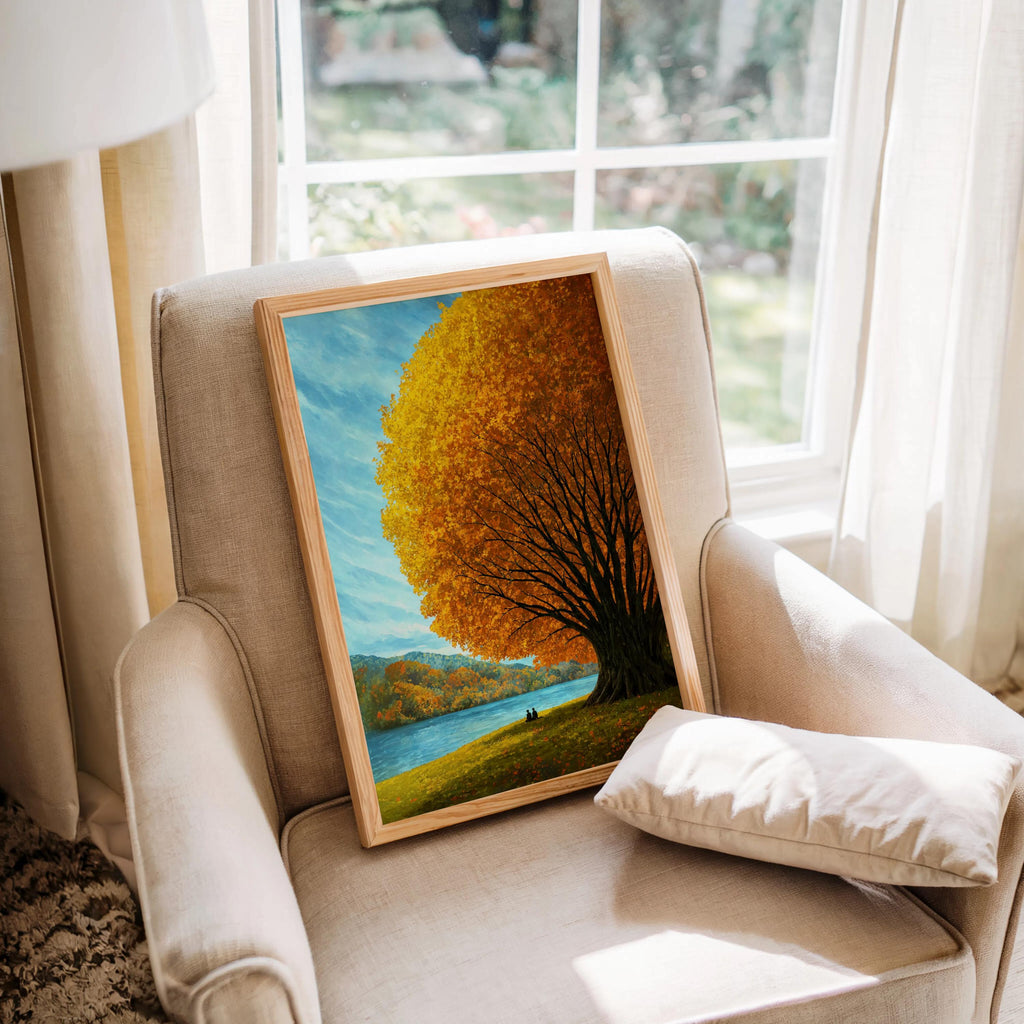 Cozy armchair with autumn tree lake wall art leaning on the cushion, colorful nature wall art and mountain lake print detail
