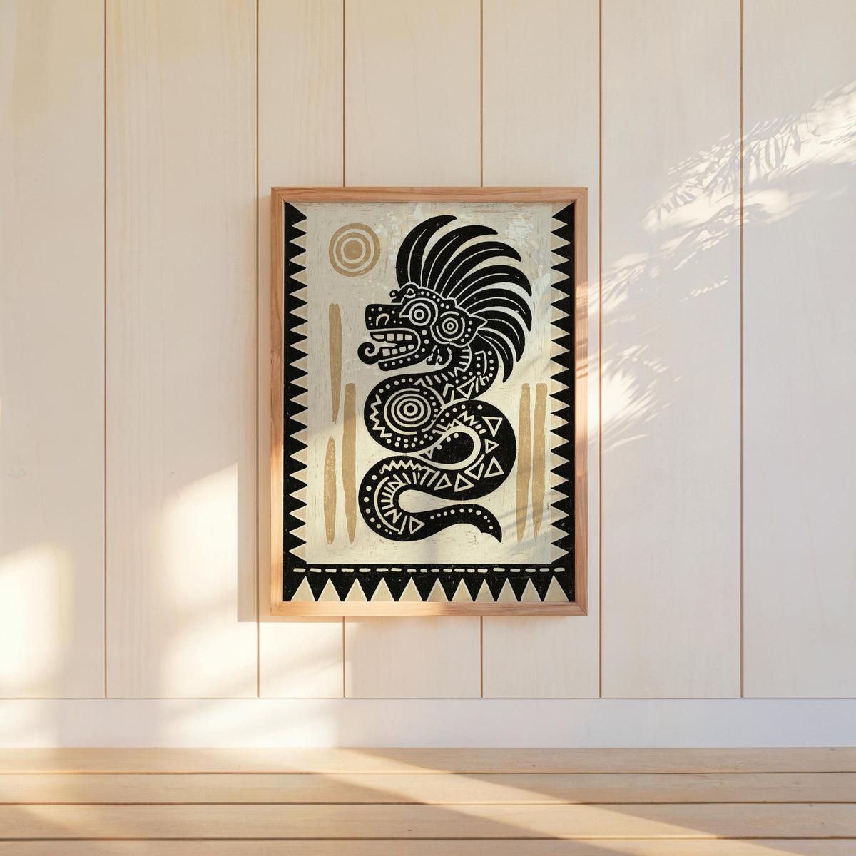 Mesoamerican wall decor, Quetzalcoatl wall art framed and hung on shiplap, geometric folk-art border visible.