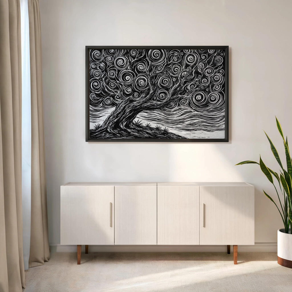 Framed black and white tree linocut print hung above a low console, clean scandinavian layout with a tall potted plant nearby
