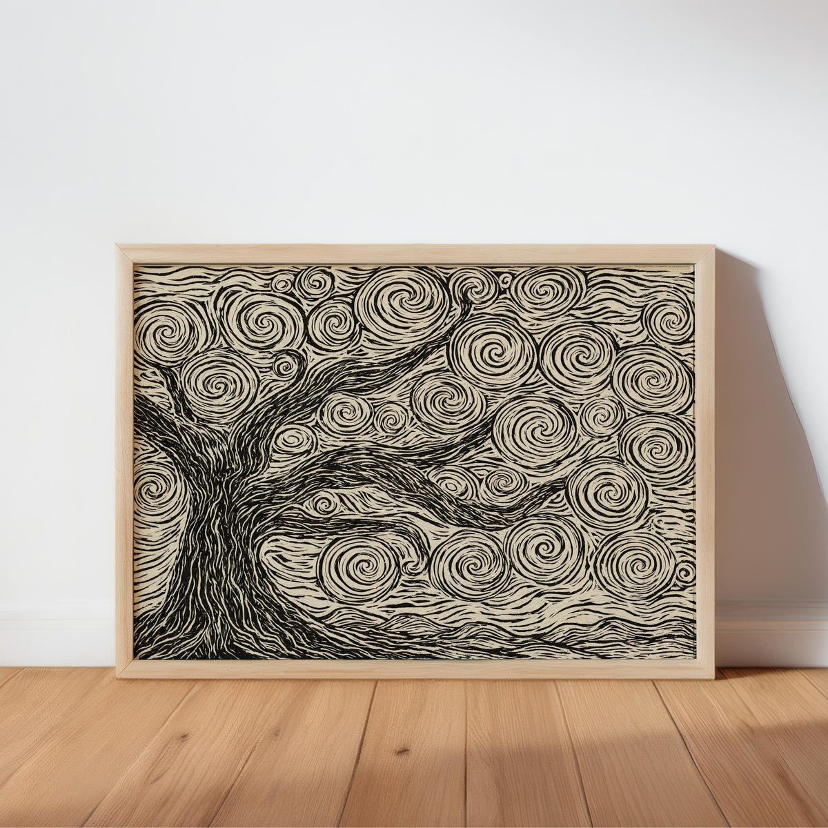 Natural wood frame resting on a floor, linocut tree print in cream and charcoal, neutral tree wall art