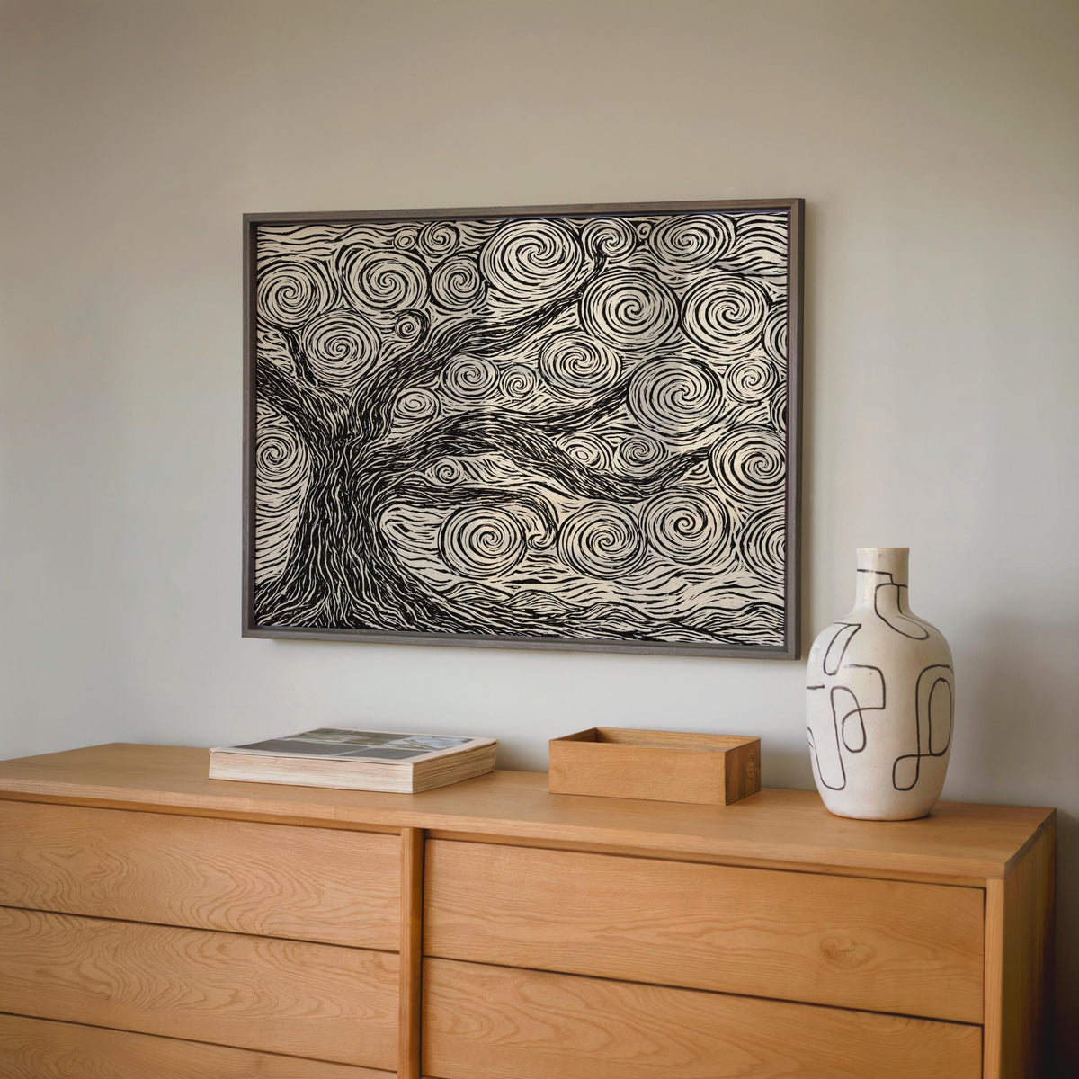 Charcoal framed linocut tree print above dresser, rustic forest art styling, boho neutral wall decor, neutral tree wall art