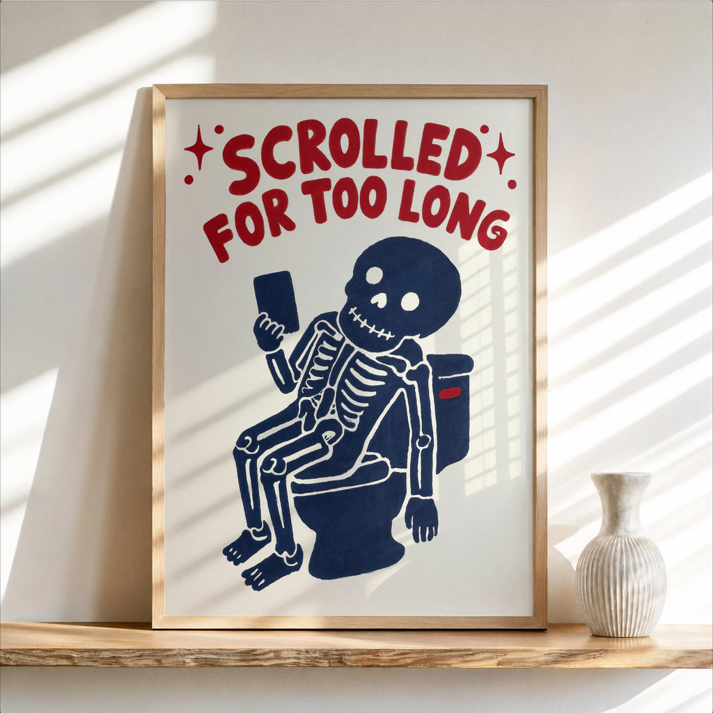 Funny skeleton bathroom art, wood-framed print of navy skeleton on toilet, red bold text
