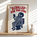 Funny skeleton bathroom art, wood-framed print of navy skeleton on toilet, red bold text
