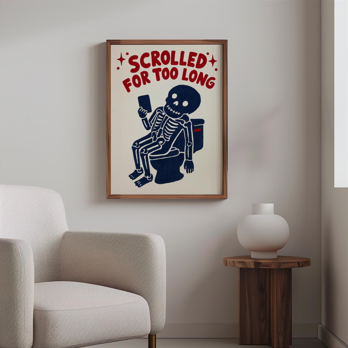 Funny skeleton bathroom art above a cozy chair, goth bathroom decor vibe with cream background and playful macabre style