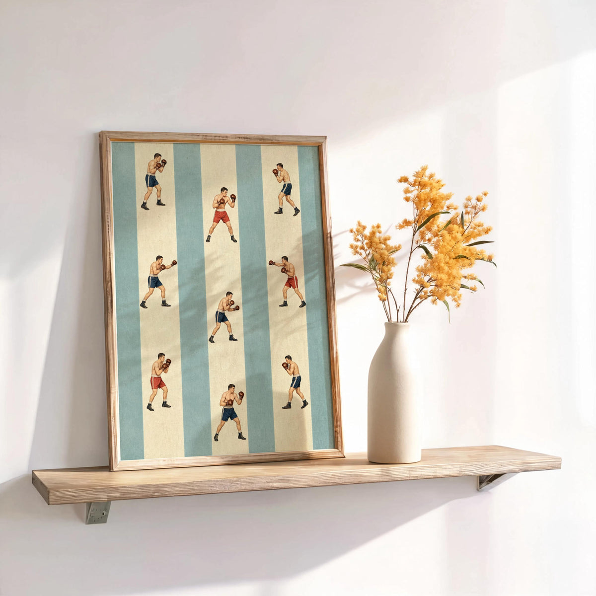 Blue-striped retro boxing poster framed on a floating shelf, dried flowers beside, mid century sports art feel