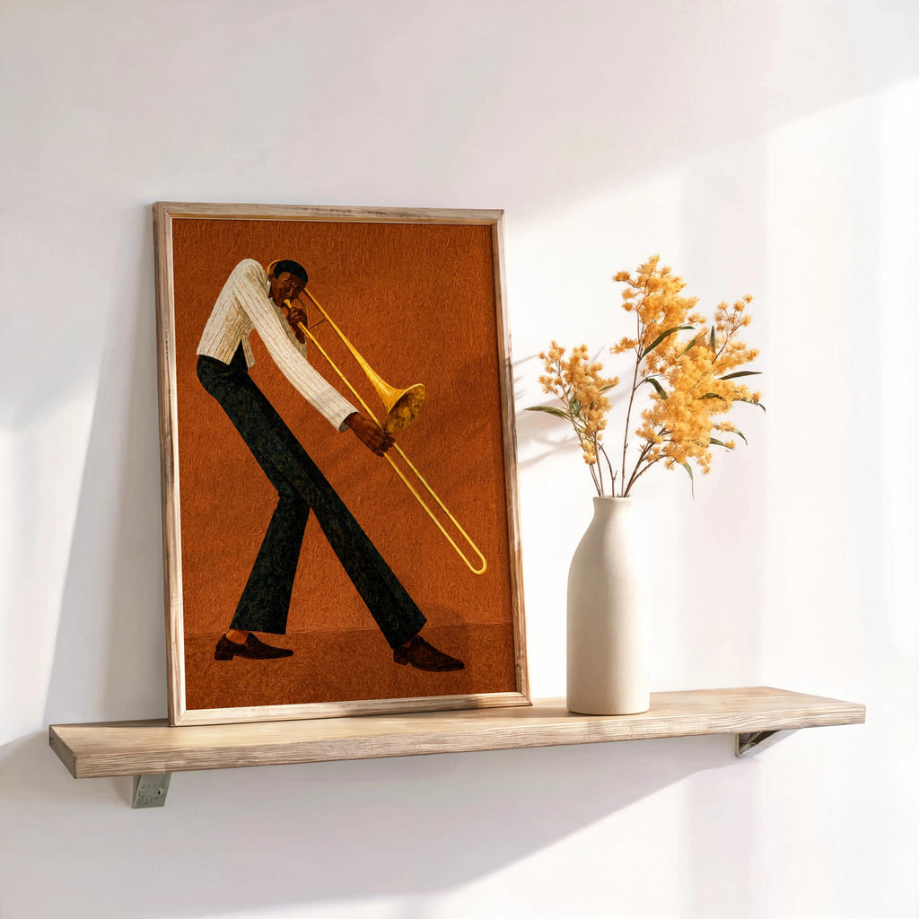 Jazz trombone wall art, rust brown framed print on shelf with dried stems, Afrocentric wall decor accent.