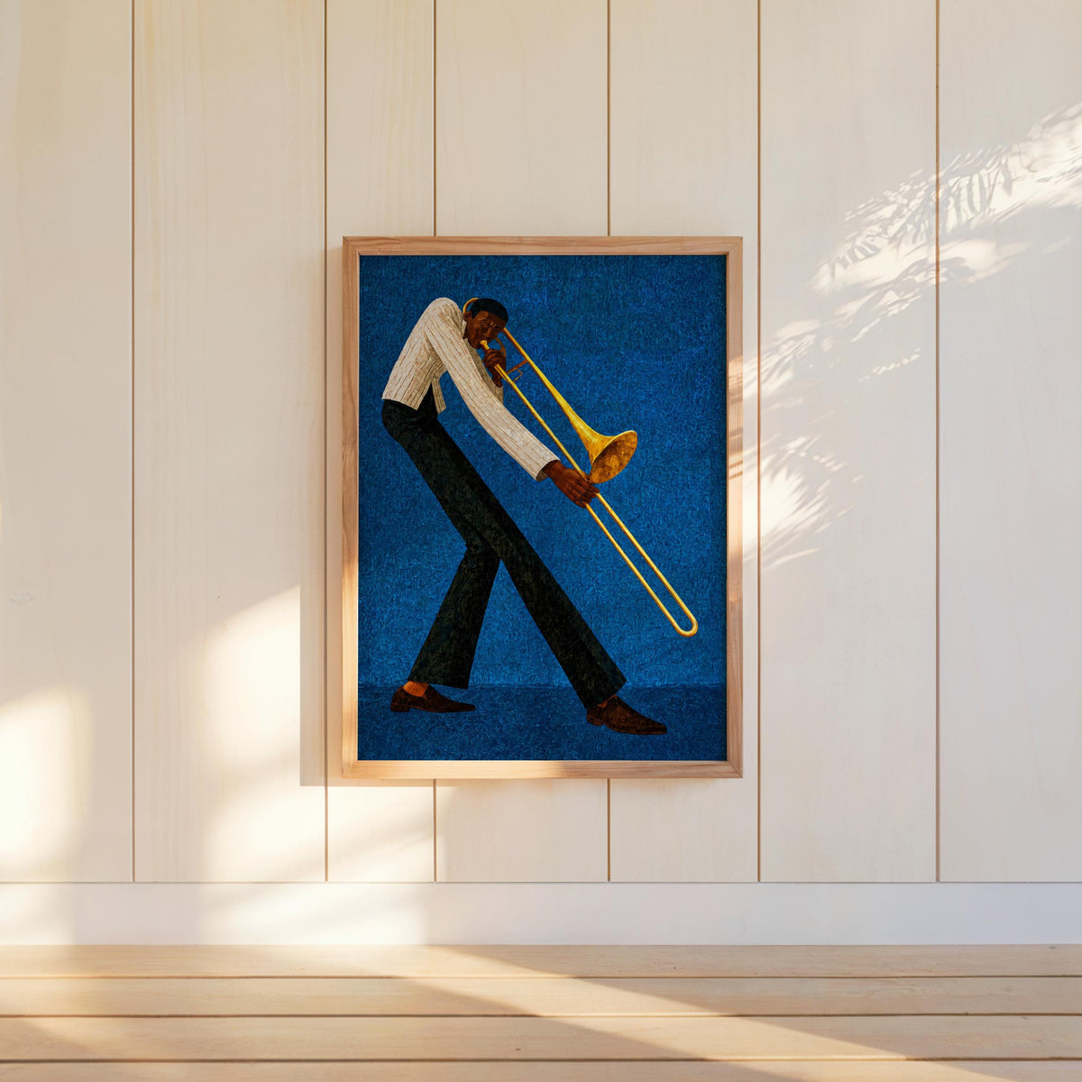 Jazz trombone wall art, rich blue framed poster on shelf, retro music wall art for jazz lovers.