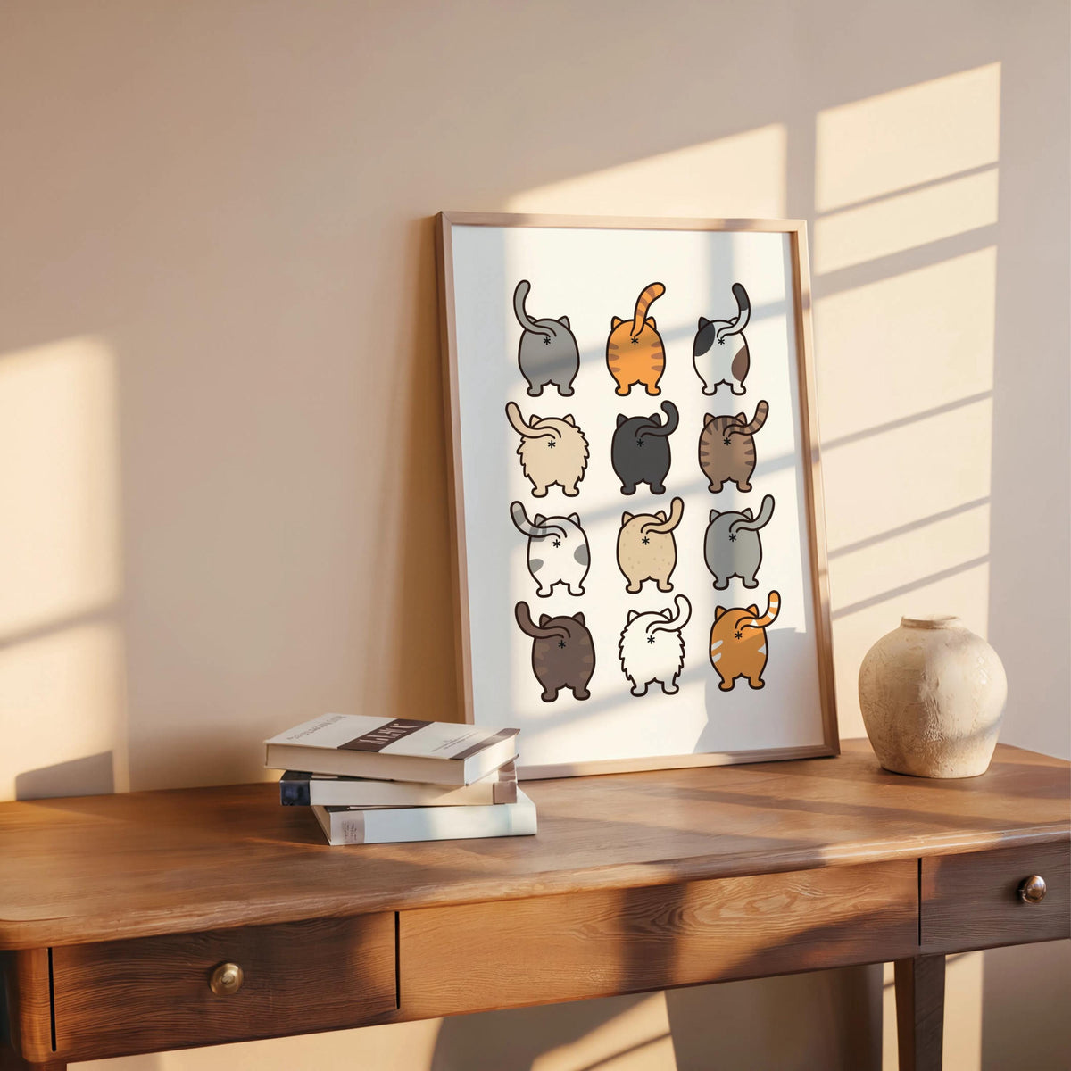 Leaned frame on a wooden table with pottery accents, rustic styling complements the playful cat butt art print, toilet room decor option
