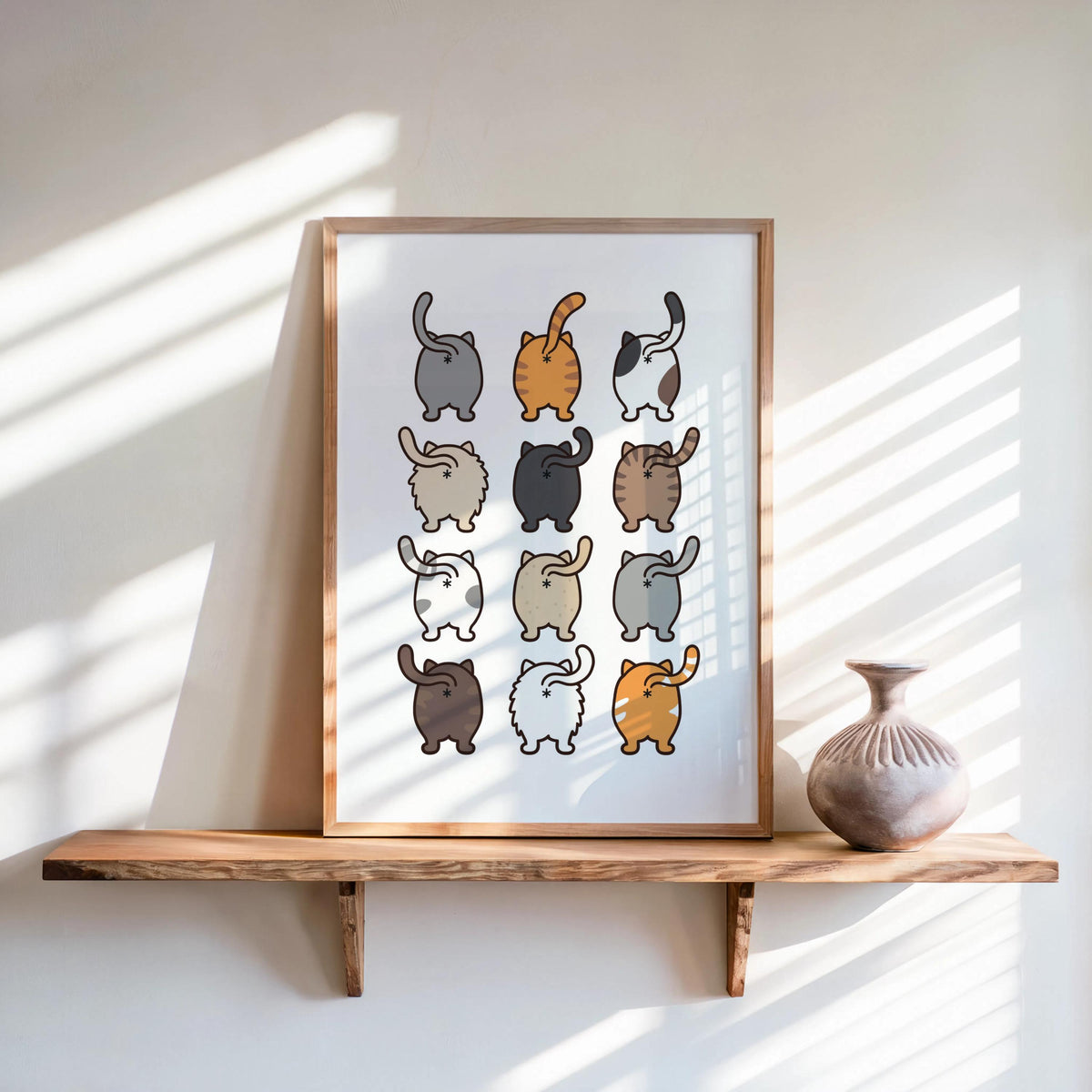 Print on a floating shelf with a small vase, sunlight and shadows highlight the quirky cat wall art, funny cat butt wall art