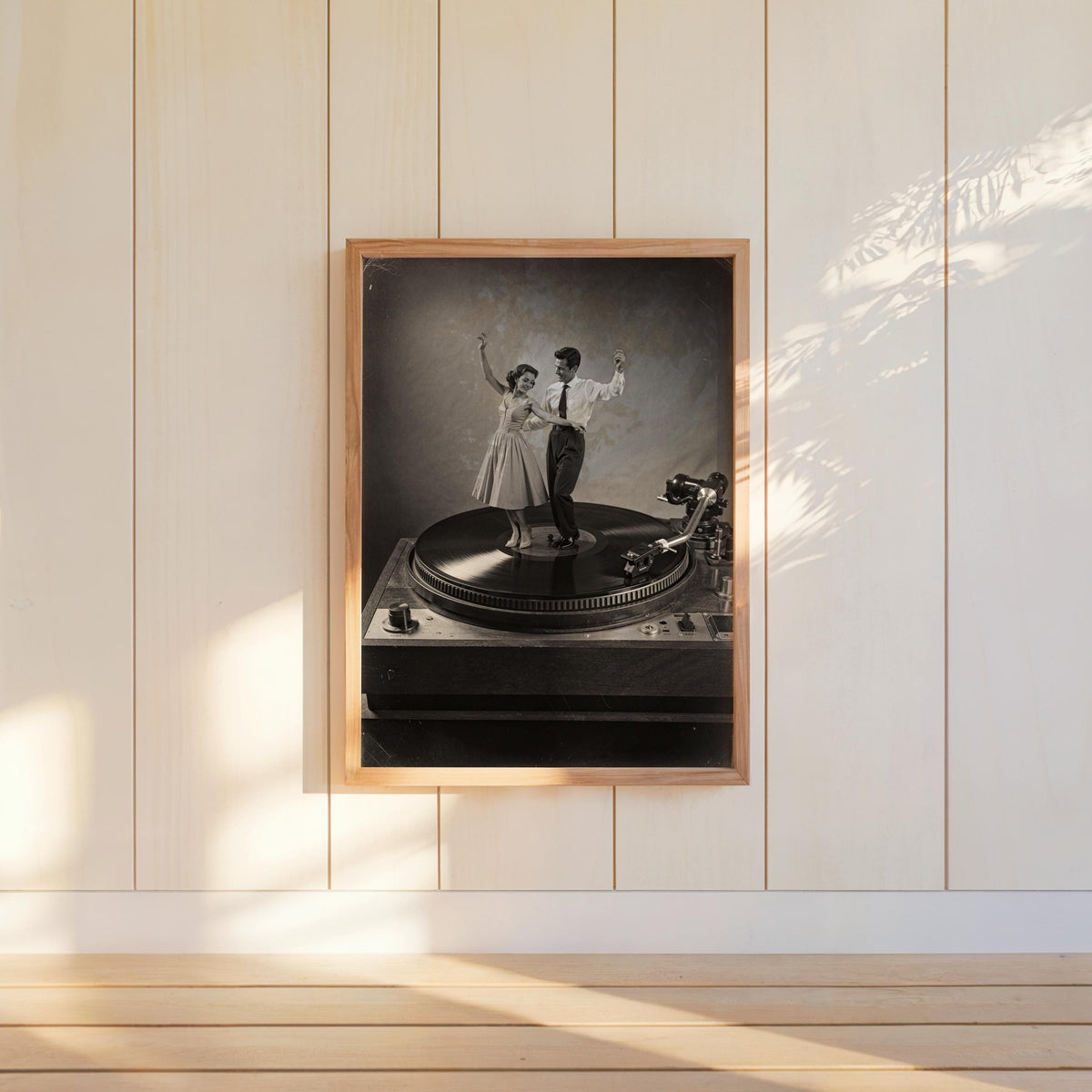 Black-and-white record player wall art hung on paneled wall, retro music poster look in a wooden frame