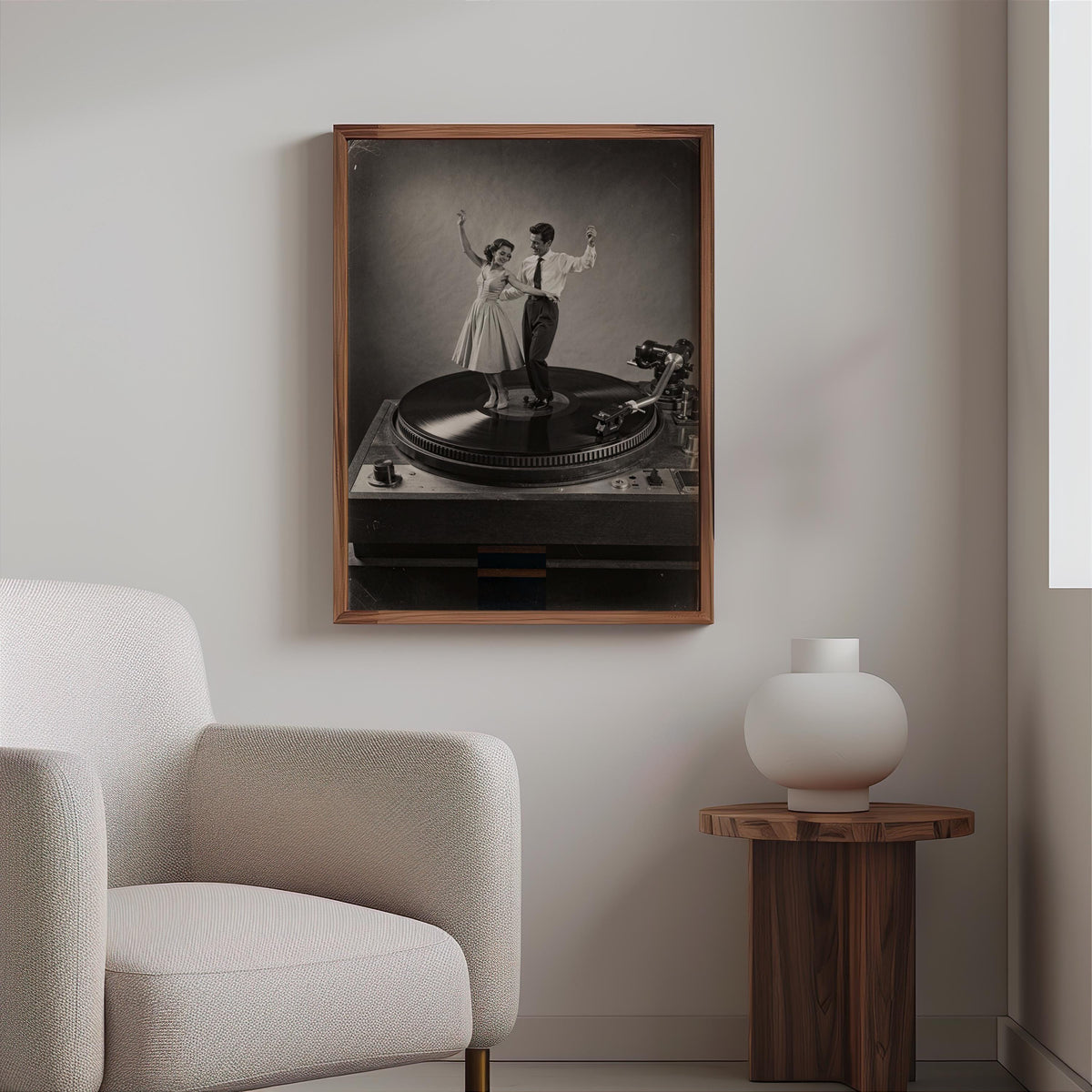 Black-and-white record player wall art above a cozy armchair and wood side table, textured decor styling