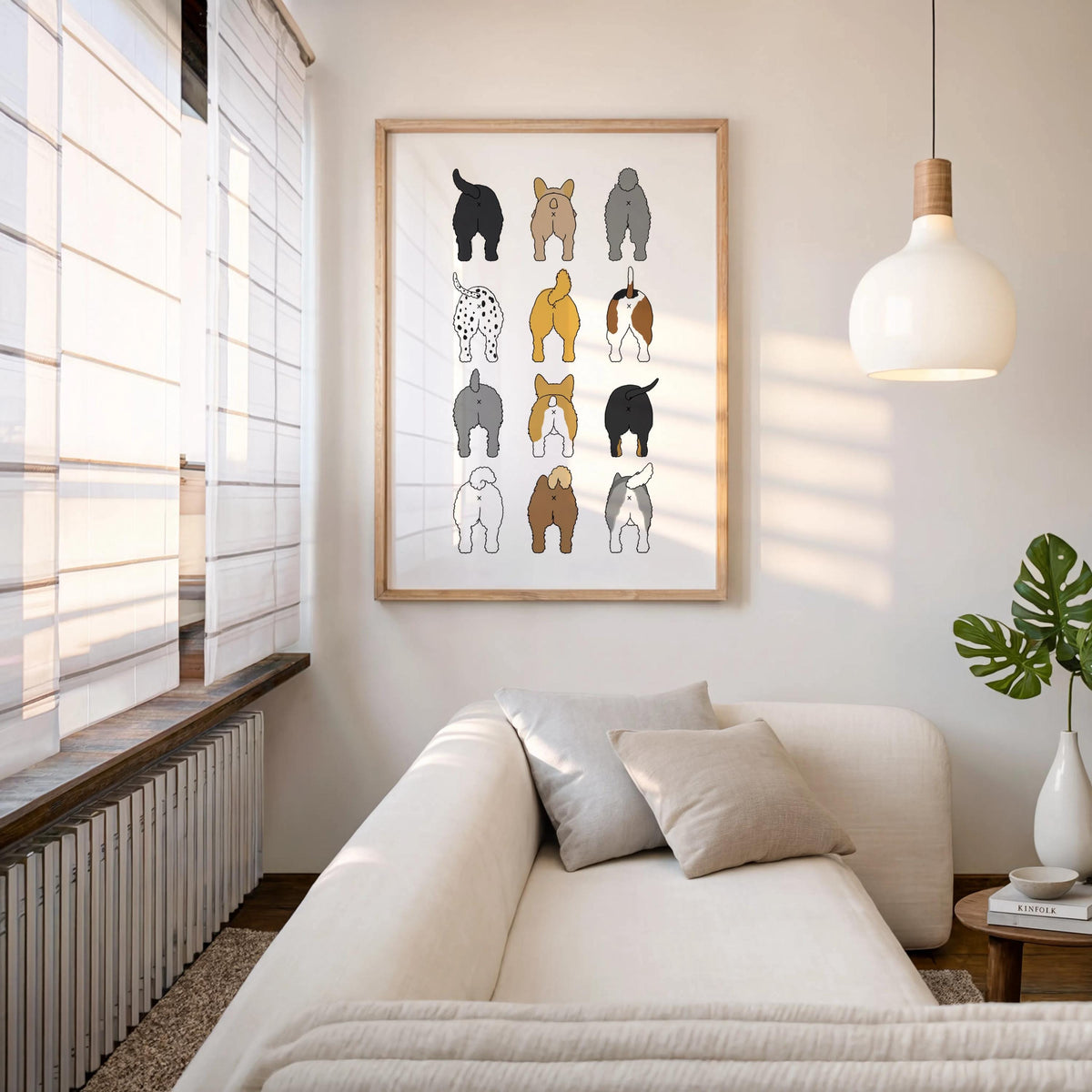 Framed dog butt grid hung above a cozy sofa with pendant lamp and window light, funny dog wall art for bathroom or living area