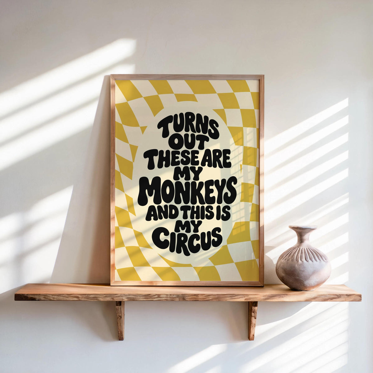 Mustard colorful retro wall art on shelf, playful wavy lettering on checkerboard, not my circus not my monkeys wall art