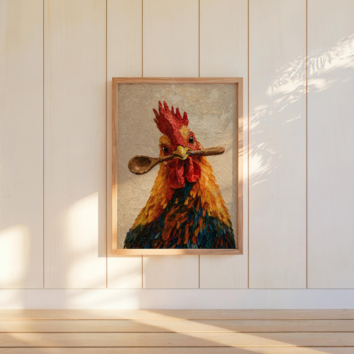 Framed rooster kitchen wall art mounted on white shiplap, warm sunlight highlights fiery red crest and spoon