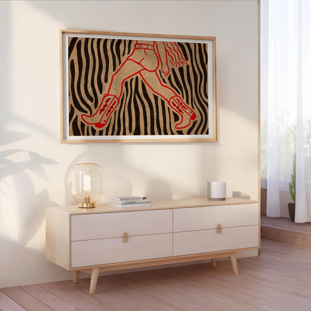 Zebra patterned cowgirl wall art print hung above console, western cowgirl wall art adding boho flair to living room
