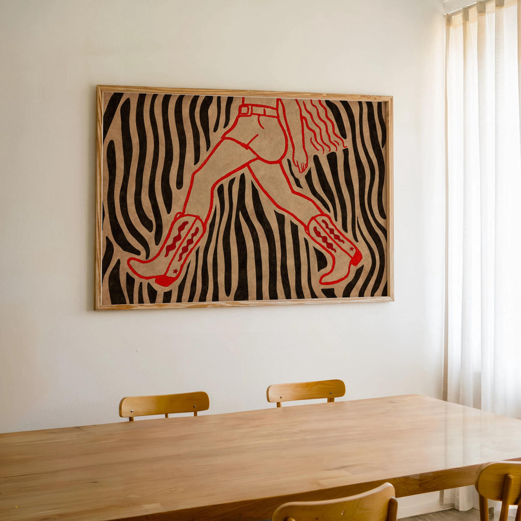 Zebra striped cowgirl wall art print centered over dining table, bold cowgirl art print bringing retro country vibes