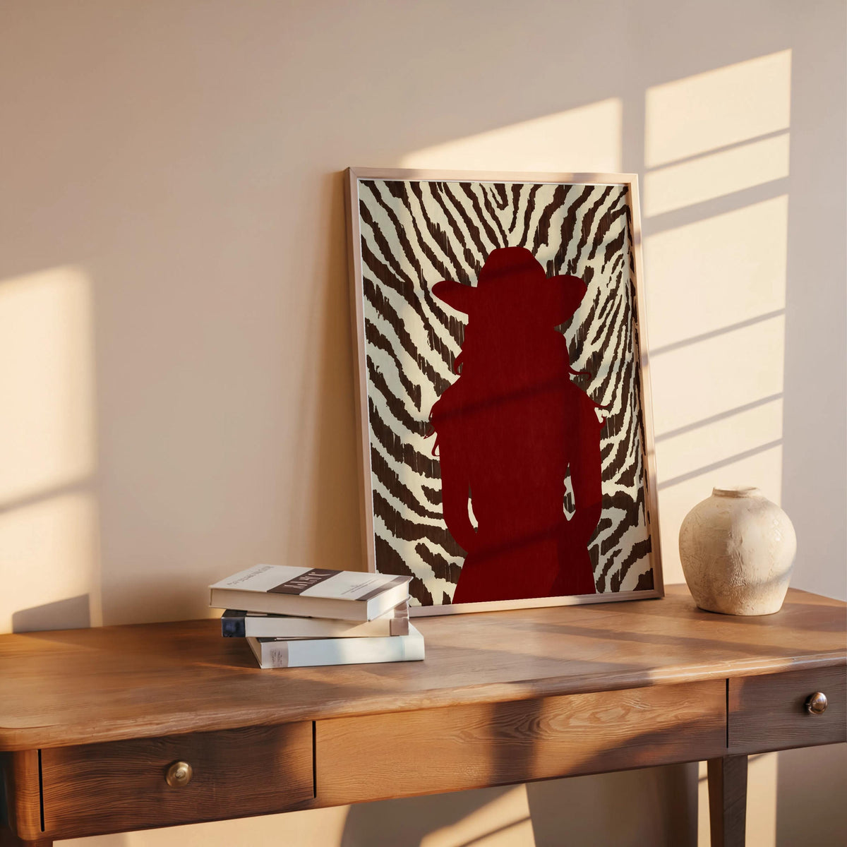 Zebra print cowgirl wall art styled on rustic desk, red cowgirl silhouette, contemporary western flair