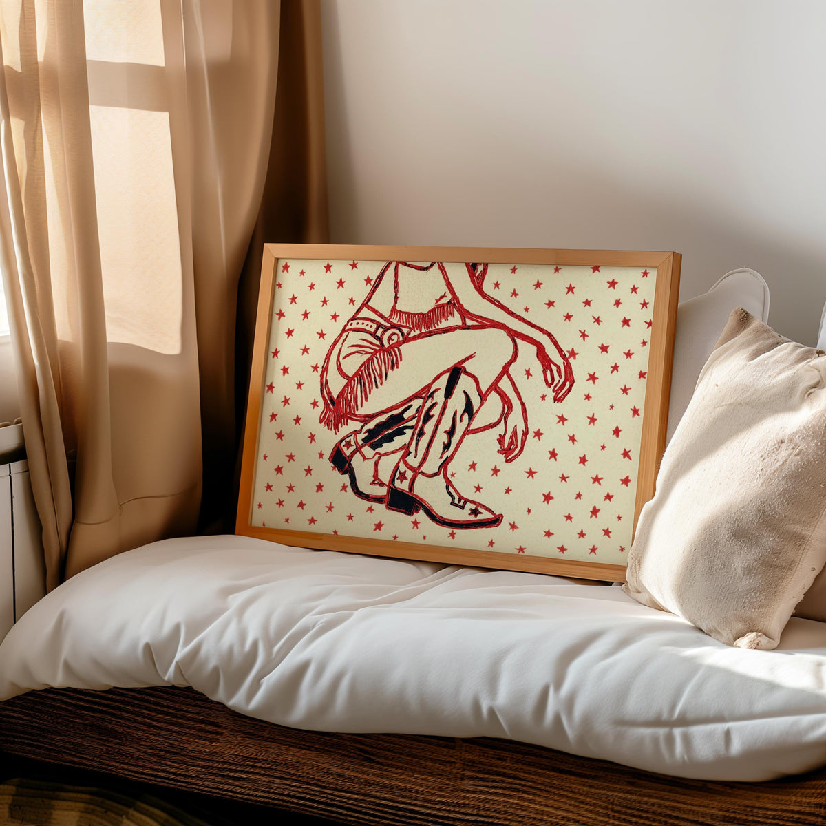 Laid-back bedroom vignette, western cowgirl wall art with scattered red stars leaning against cozy pillow and throw