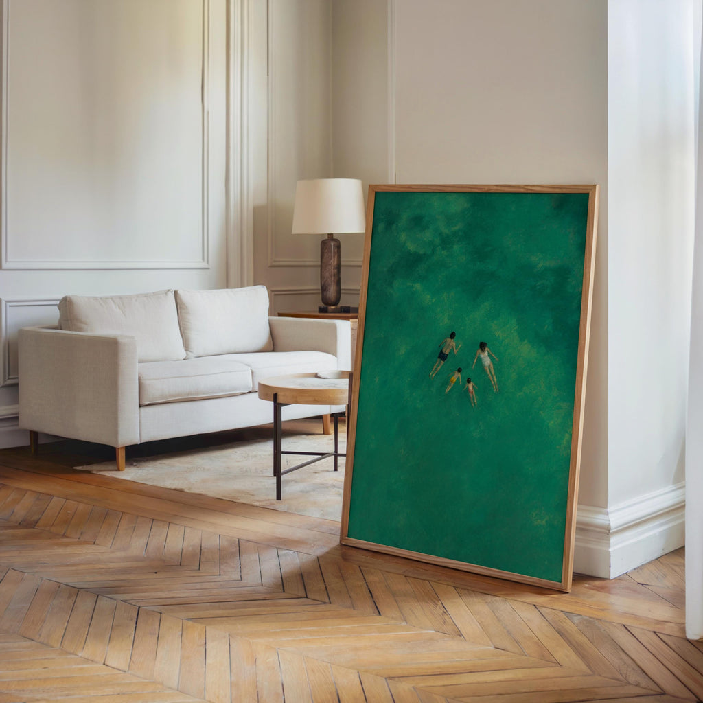 Swimming family print leaning in a modern entryway, coastal living room styling, tiny figures in teal water