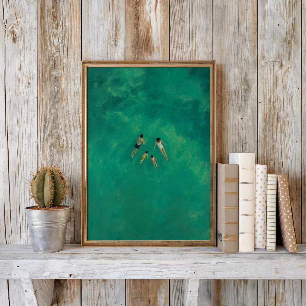 Overhead swimmers print against reclaimed wood planks, teal ocean wall art styled with a small cactus