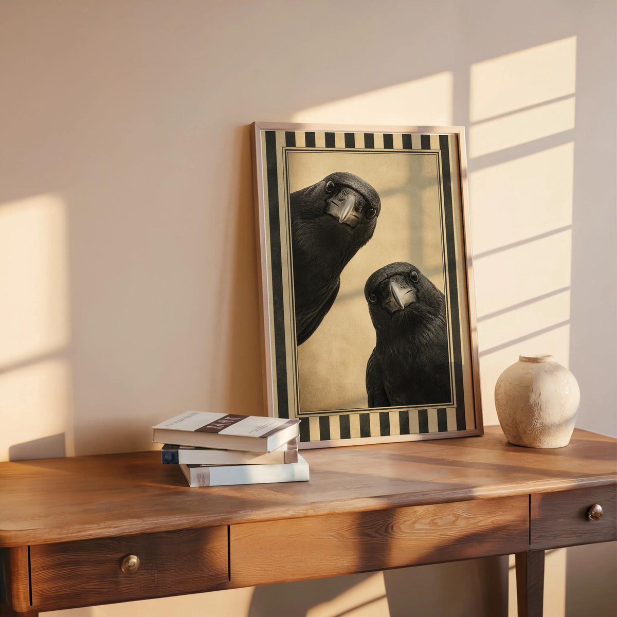Raven wall decor leaning on a wooden desk in warm sunlight, narrow vintage-style border, creepy cute bird art charm