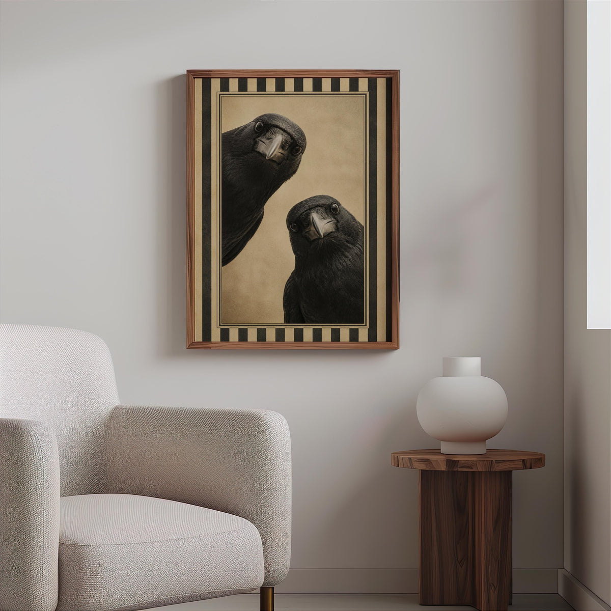 Framed black bird wall decor hung above a boucle chair, warm antique beige tones, striped vintage poster