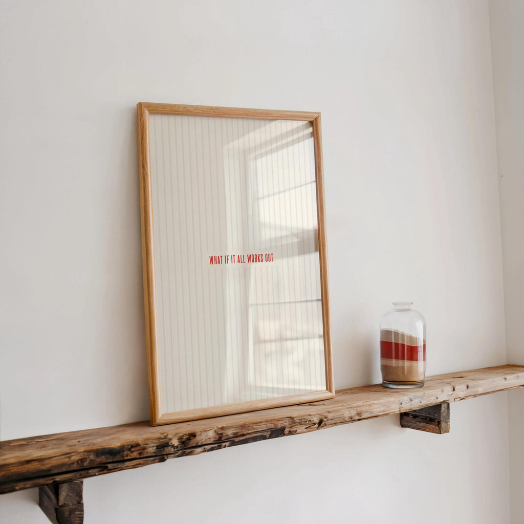 Narrow shelf vignette with framed what if it all works out poster, glass jar candle, morning light