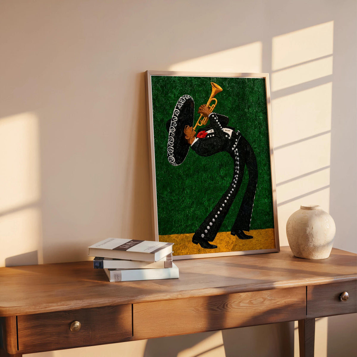 Green mariachi wall art print displayed above a wood shelf, books and a ceramic orb on the shelf, contemporary latin music wall art