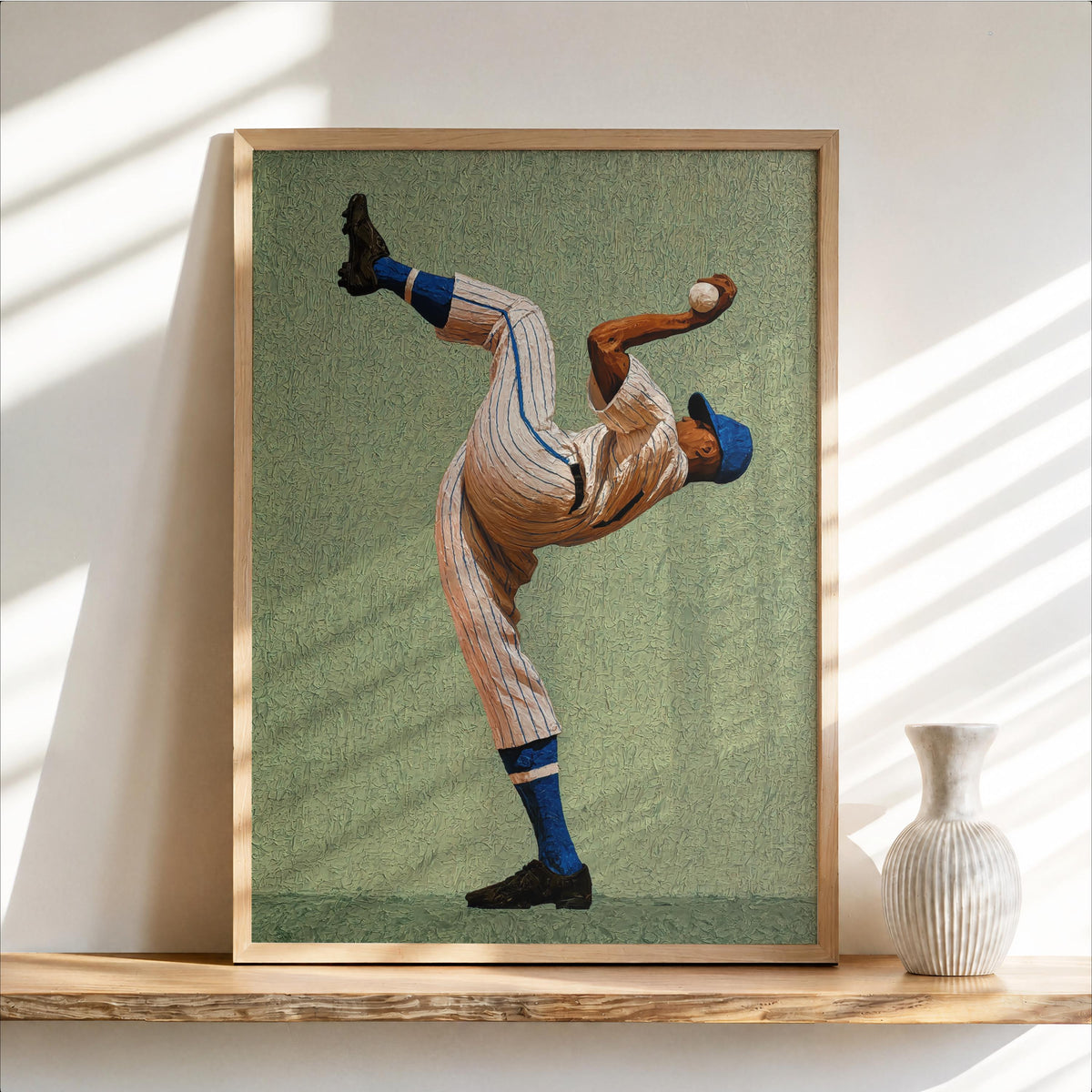 Framed portrait print on textured green field tone, stylized Afrocentric pitcher pose, baseball pitcher wall art, framed mockup, frame not included