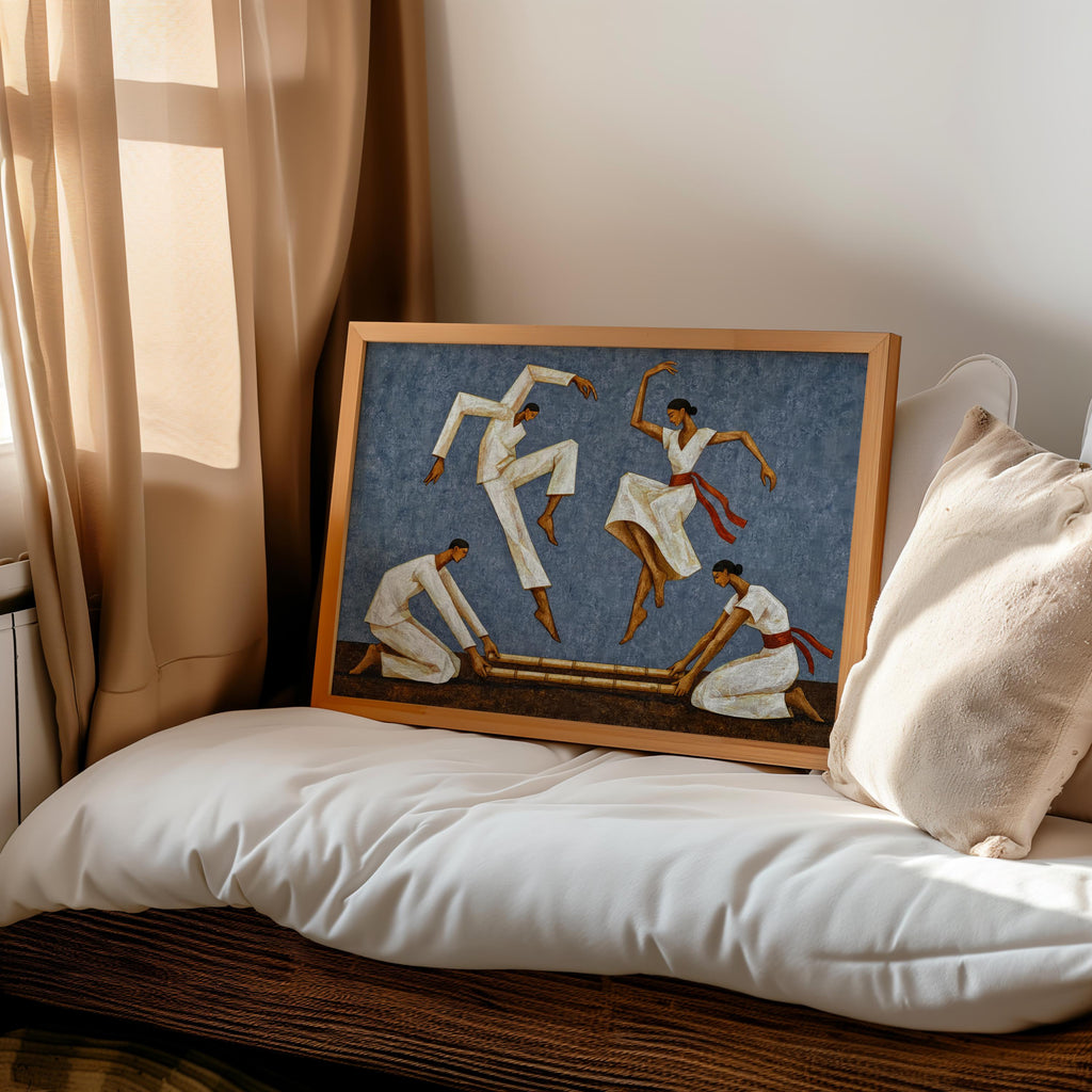 Slate blue Tinikling art print leaning on a cushioned bed, Southeast Asian wall art mood in soft light
