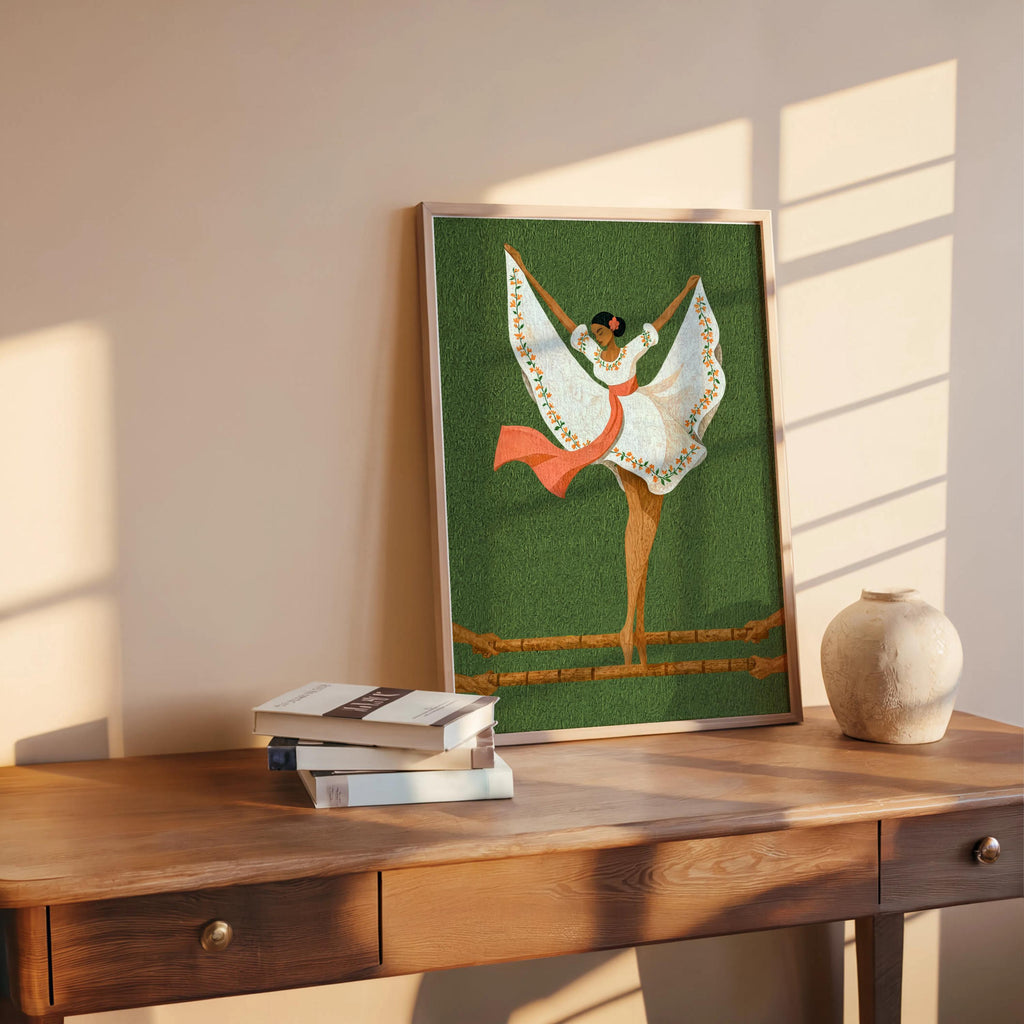 Styled room shot, green Filipino folk dance wall art propped on wooden table, warm sunlight highlights textured paper