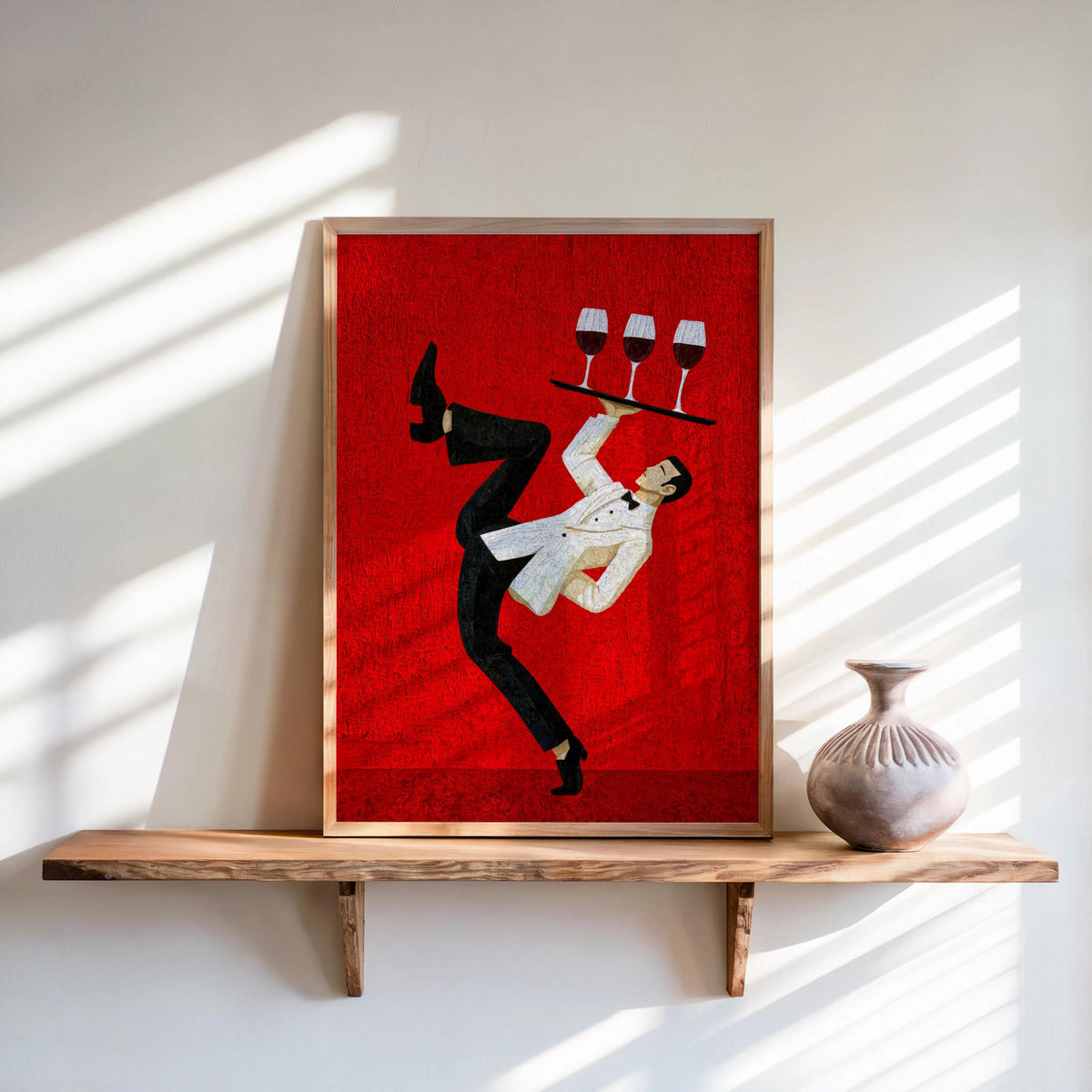 Framed red print on a sunlit wooden shelf, silhouetted dancing waiter with tray, wine bar wall art, retro bar cart decor