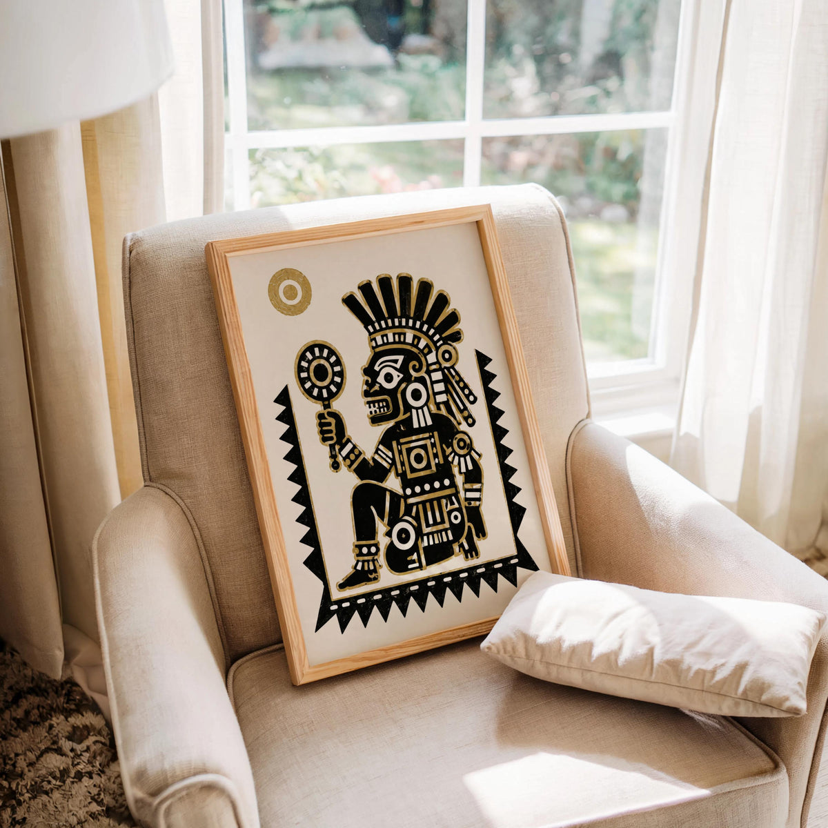 Comfortable armchair featuring a framed Tezcatlipoca art print, Aztec deity poster shown at relaxed scale
