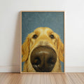 Framed print leaning on floor with blue background, playful golden retriever nose art close up