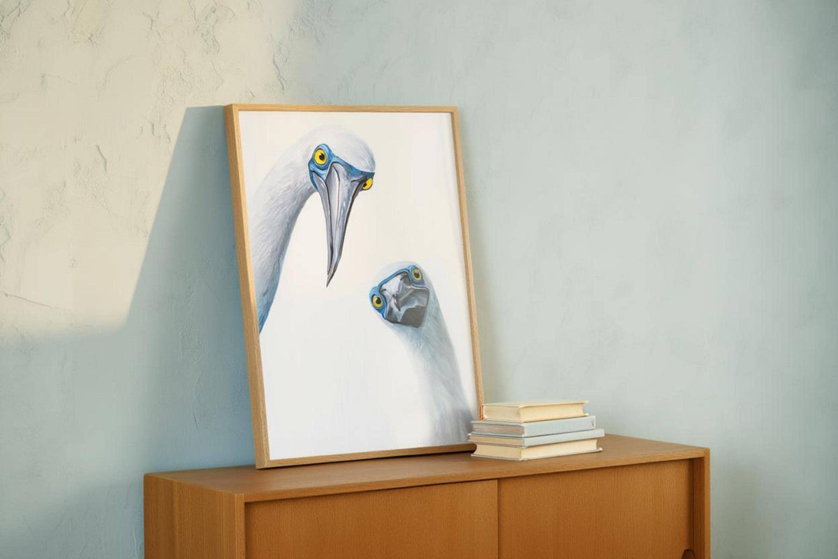 Frame on low sideboard with soft mint wall behind, mid century modern animal art styling, blue footed booby wall art print