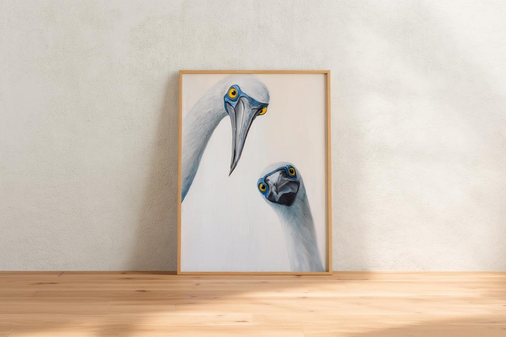 Slim frame centered on the floor against pale wall, clean minimalist styling, whimsical bird art print, blue footed booby wall art print