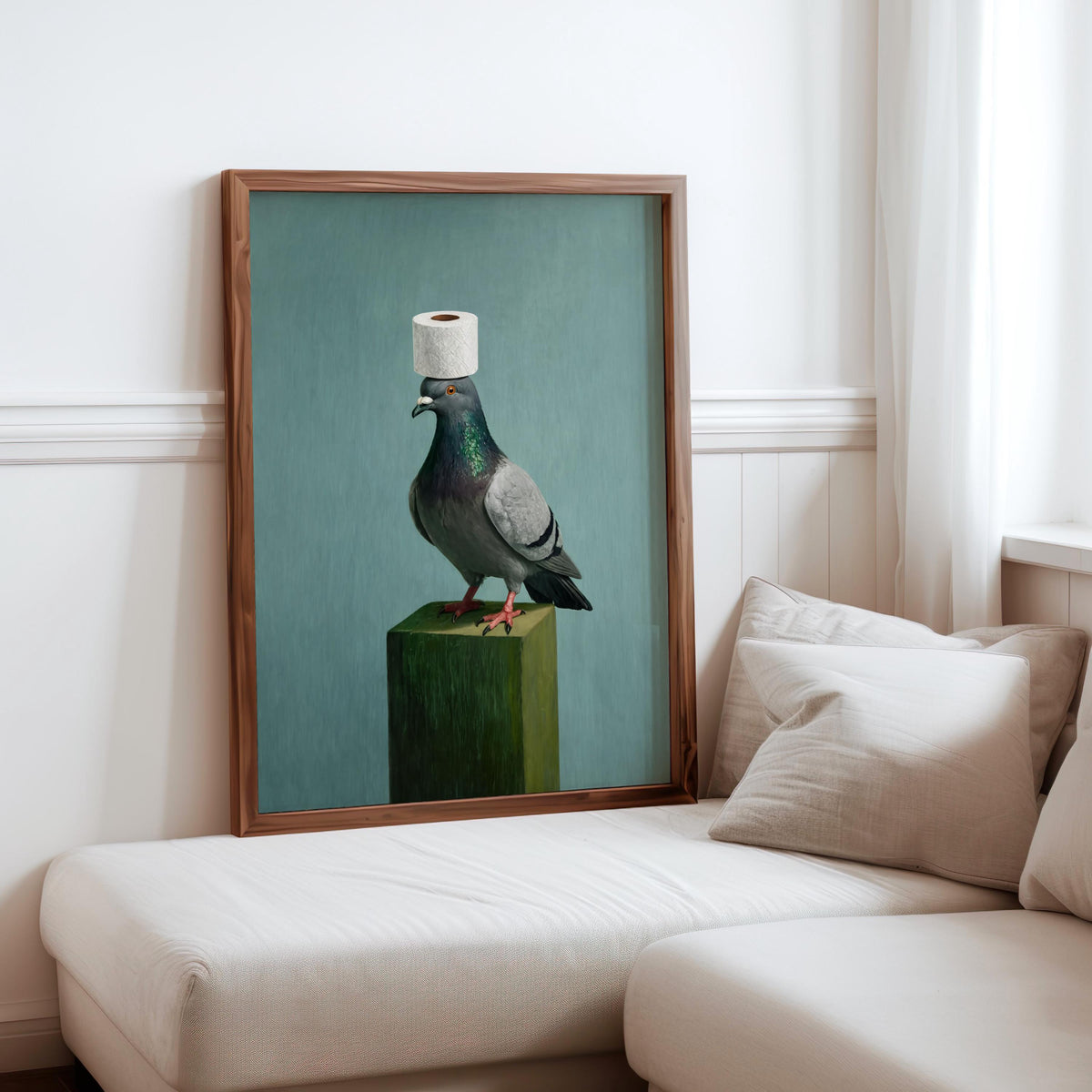 Framed-style mockup of funny pigeon wall art above sofa, surreal bird print with muted teal, frame not included