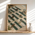 Framed cowboy beach wall art leaning on sunlit shelf, tiny cowboys on green striped beach towels, preppy western decor