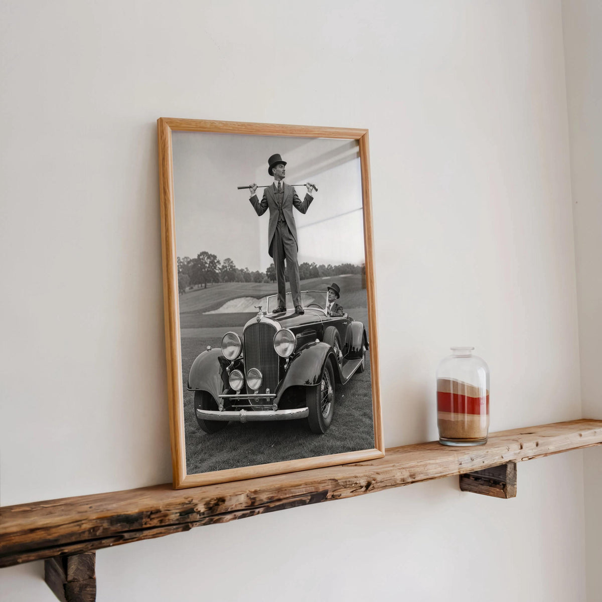 Long rustic shelf display, wood-framed retro golfer poster, subtle country club wall decor and nostalgia