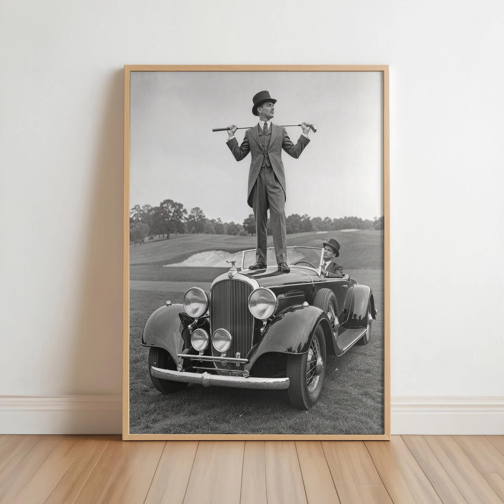 Framed black and white golf print leaning on a hardwood floor, natural wood frame, vintage golf wall art