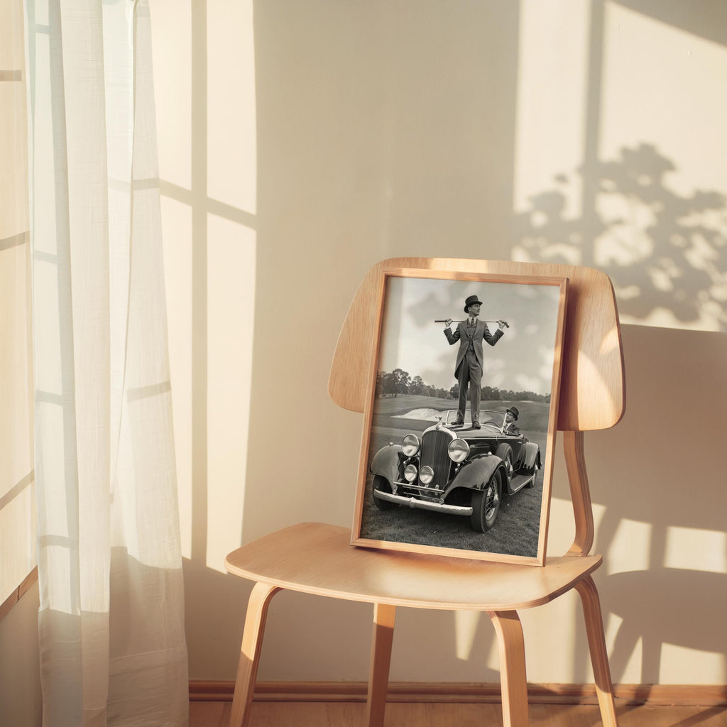 Cozy corner with lamp, framed black and white golf print resting on a chair, perfect golf room decor gift