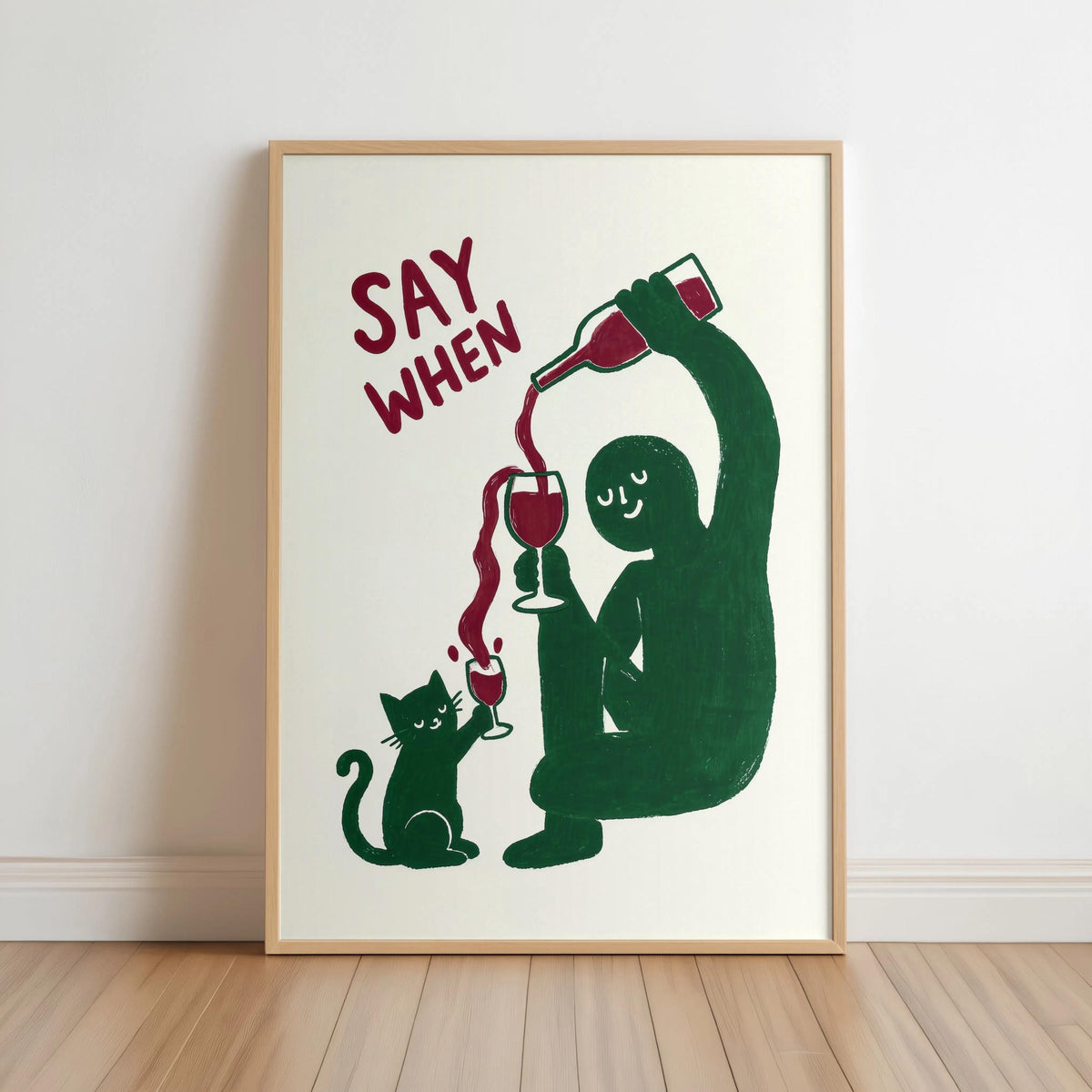 Framed green retro SAY WHEN poster leaning on hardwood, textured cream paper, quirky retro wine poster, funny cat wine wall art