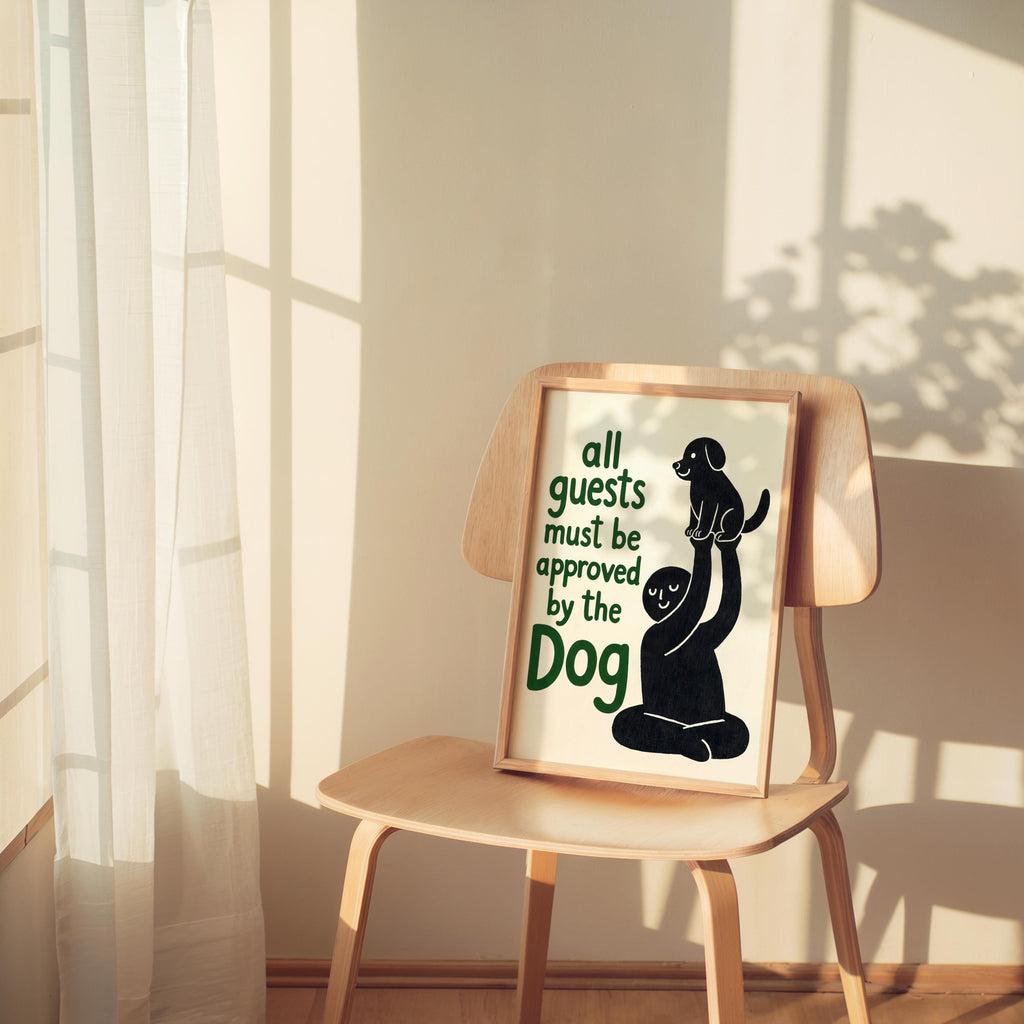 Black dog poster casually placed on a small chair with soft sunbeams, humorous dog print styled as pet lover home decor